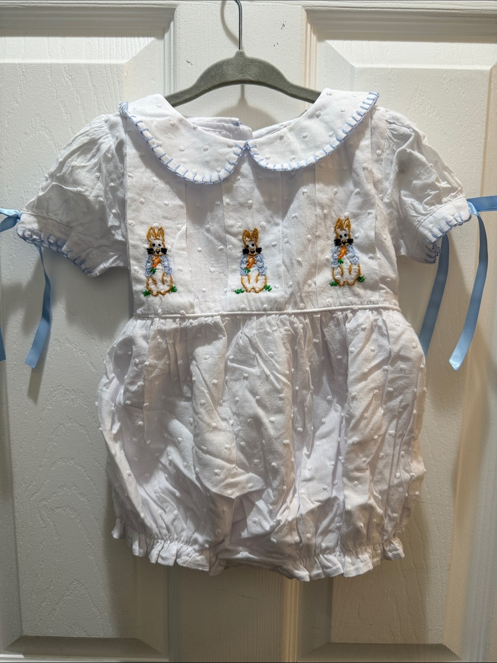 White Swiss Dot Baby Romper with Blue Trim and Bunny Embroidery